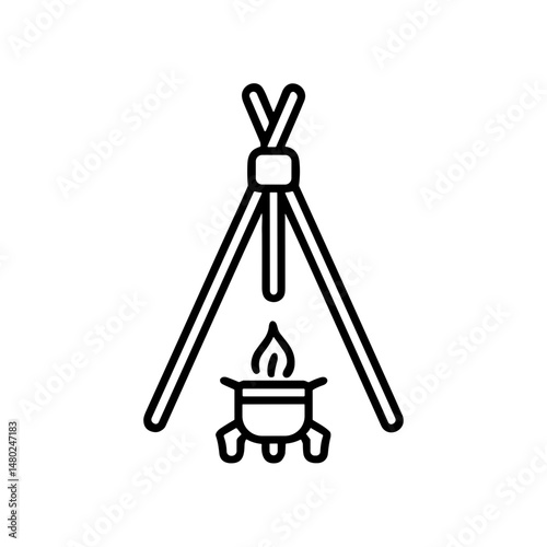 Tripod over fire with cooking pot in children summer camp setting  