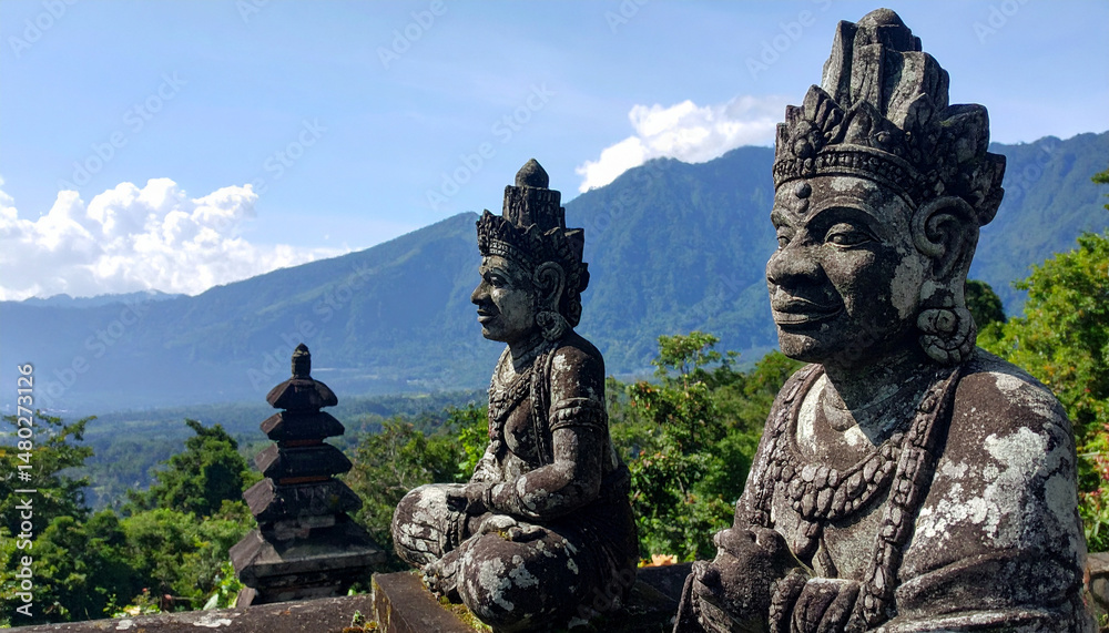 Obraz premium Serene Balinese stone statues overlooking lush mountain view create tranquil atmosphere, inviting reflection and peace. intricate details of statues enhance natural beauty surrounding them