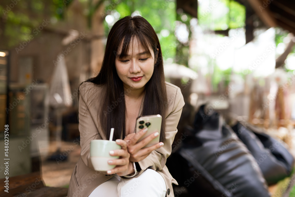 Portrait of young woman in a cafe using phone Portrait of young woman in a cafe using phone