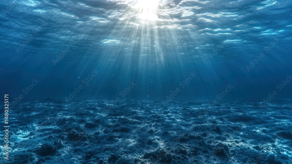 Obraz premium Sunbeams pierce deep ocean floor