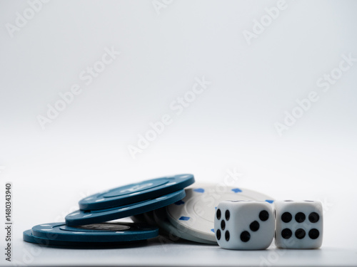 Dice and poker chips on white background