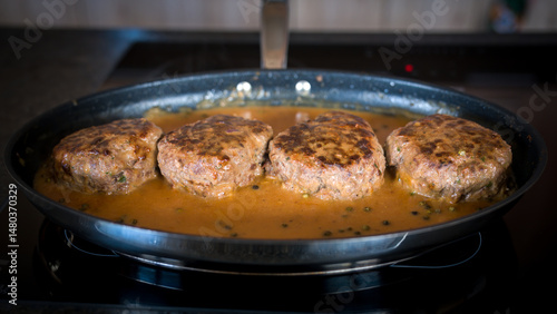 meat balls with pepper sauce roasted in a pan