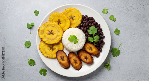 Cuban Dish Composed Of Black Beans Rice And Fried Plantain Tostones