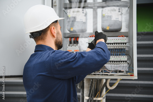 Obraz na plátně Electrical engineer approving power distribution box installation on site