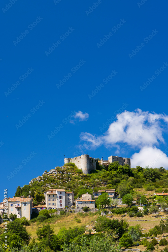 Obraz premium Trigance castle overlooking the village in Provence, France, under blue summer sky