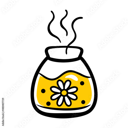 Aromatherapy diffuser with yellow liquid and flower design