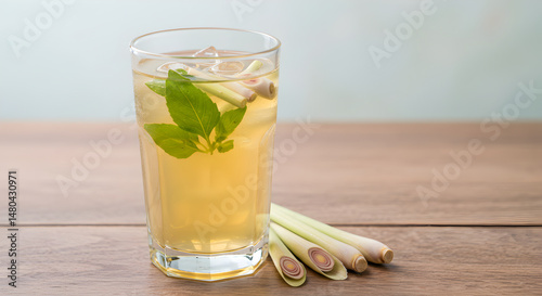 Refreshing Lemongrass Drink With Basil Leaves On Wooden Table Background