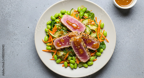 Delicious Seared Tuna Steaks Served with Edamame and Fresh Vegetable Salad
