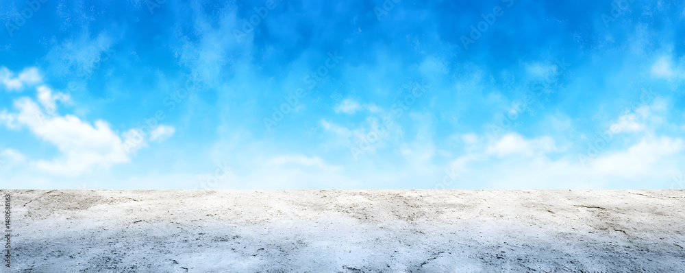 Obraz premium Vast barren landscape under a bright blue sky with minimal clouds during midday sunlight
