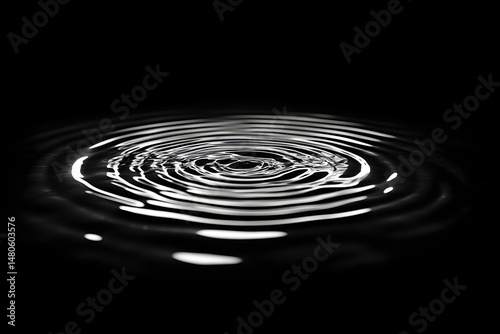 A serene image showcases concentric circular water ripples, illustrating the subtle beauty of water dynamics. 