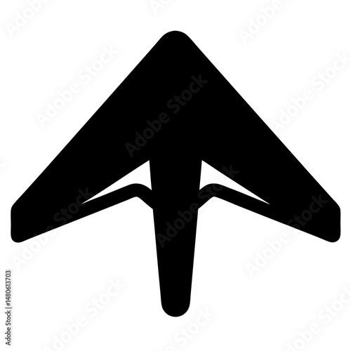 Black silhouette of a hang glider soaring through the sky with freedom