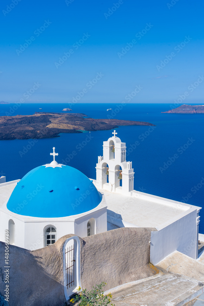 Obraz premium Three Bells of Fira in the town of Fira, Santorini, Greece. The Three Bells of Fira, officially known as The Catholic Church of the Dormition, is a Greek Catholic church on the island of Santorini.