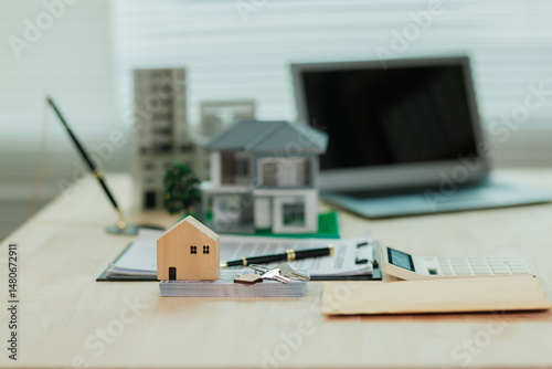 Obraz na płótnie A real estate agent presents a model home to a client, offering it as one of the options to help them make an informed purchasing decision. w salonie