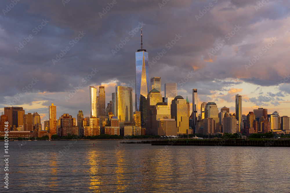 Obraz premium NYC, New York City Skyline with dramatic sky clouds. New York Skyscrapers. New York City skyline, cityscape of Manhattan in USA. Panoramic view on Manhattan. New York skyline. NYC, NY city.