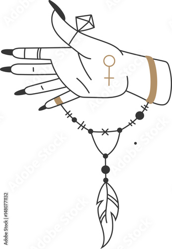 Woman hand with black nails, rings and bracelets, decorated with venus symbol and holding a feather pendant, representing esotericism, spirituality, and occult practices