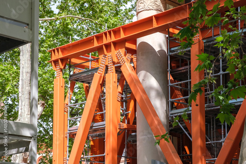Εκτύπωση καμβά Heavy-duty steel scaffolding supporting the restoration of a historic building i