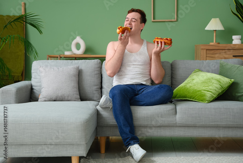 Young happy overweight man ...