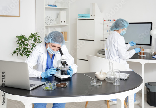 Female scientist looking th...