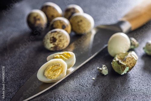 Obraz na płótnie Boiled quail eggs on black table. w salonie