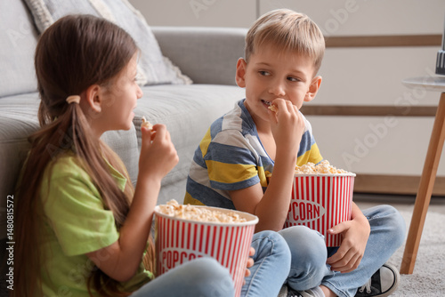 Little children with popcor...