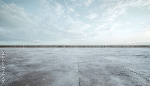 Wallpaper Mural flat concrete ground stretching into the distance, with a large rough concrete wall in the far background, empty and minimal environment Torontodigital.ca