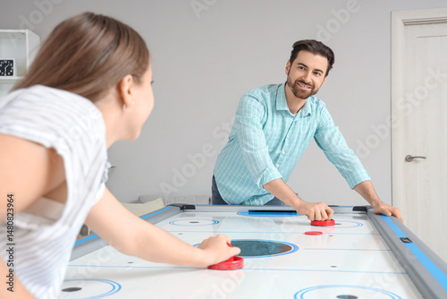 Happy couple playing air ho...