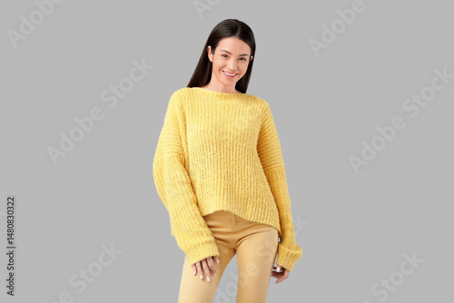 Smiling young woman in cozy...