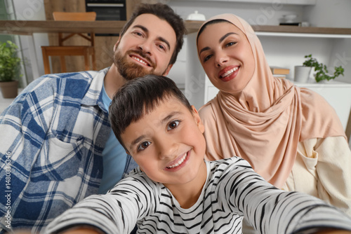 Happy Muslim family taking ...