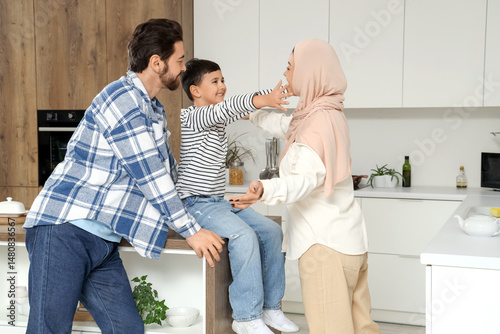 Happy Muslim family hugging...