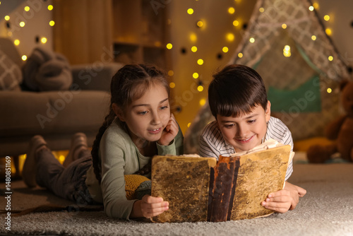 Cute children reading adven...