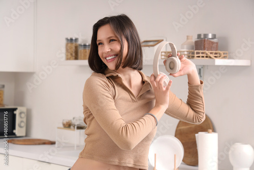 Young woman with headphones...