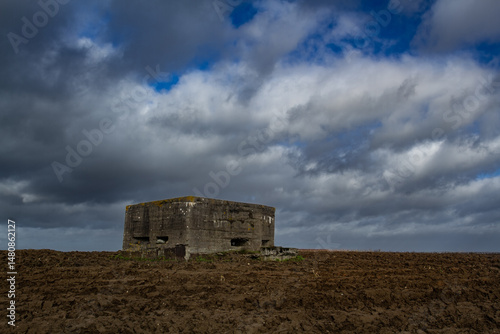 Bunker of world war one preserved in agricultural field. Remnant of the past, conflict of 20th century in Western Europe.