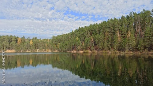 Nature scenery. Autumn forest lake. Autumn in forest lake. Colorful trees reflecting in calm water surface. Autumn park with lake. Seasonal specific. Autumnal landscape with wood river