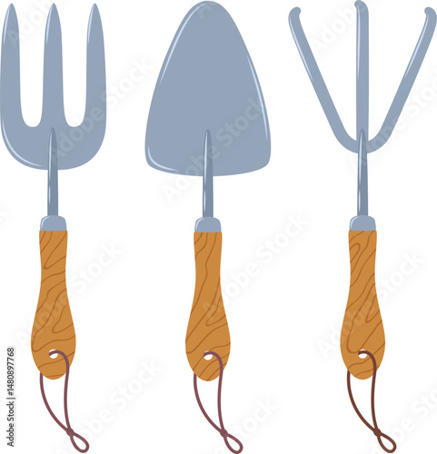 Gardening tools set including hand rake, trowel and hand fork with wooden handle and steel tip isolated on white background representing gardening, planting, hobby and agriculture