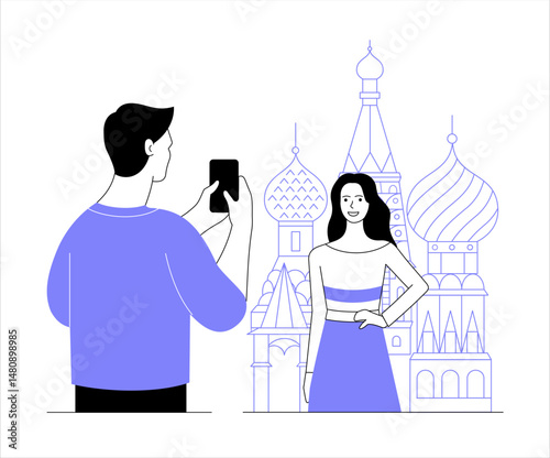 A guy takes a picture of a girl in the background. St. Basil's Cathedral in Moscow.