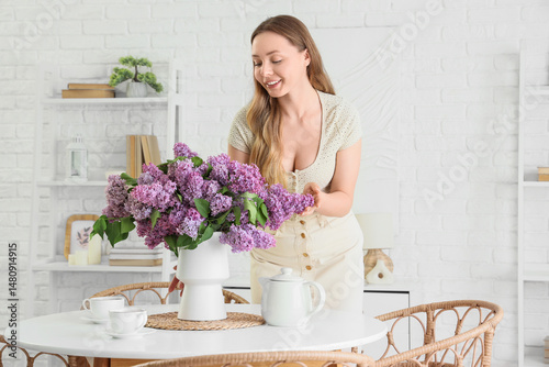 Young woman and vase with l...
