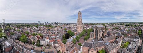 Wide panorama 180 degrees aerial view of the medieval Dutch city centre of Utrecht with cathedral towering over the city at early morning sunrise. Cityscape in The Netherlands