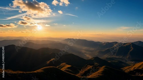 The mountains and sunlight create a peaceful and beautiful landscape.
