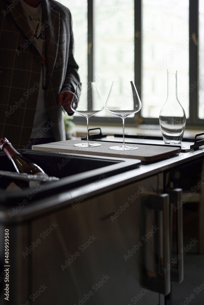 Φωτογραφία Clean wine glasses and decanter are on the table of a special wine cabinet, styl