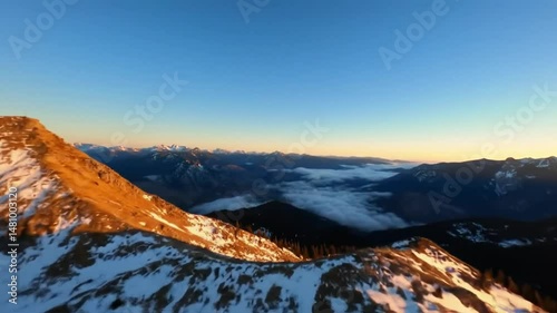 Majestic Mountain Range Aerial Drone Shot at Sunrise Golden Hour
