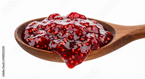 Red jam in a wooden spoon.
