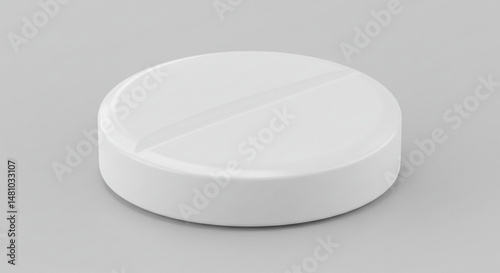 Another small, round, white tablet or pill.
