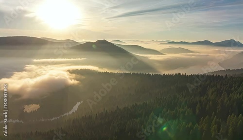 Morning Mist over Mountains: A stunning panoramic vista of mountains draped in a veil of ethereal mist, illuminated by the soft glow of sunrise, showcasing the serene majesty of nature.