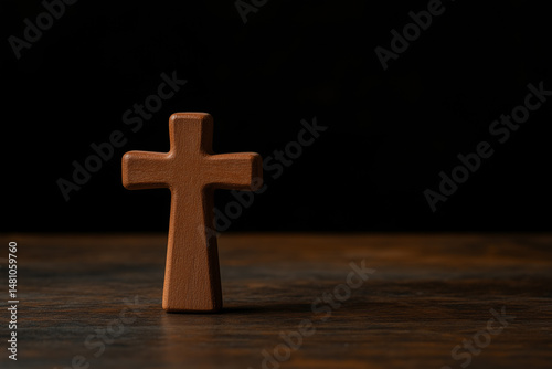 Wooden Cross Symbolizing Faith and Spirituality in a Dark Background Setting