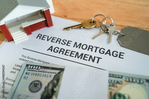 Close up of reverse mortgage agreement contract. Concept of getting an equity loan of your primary home.