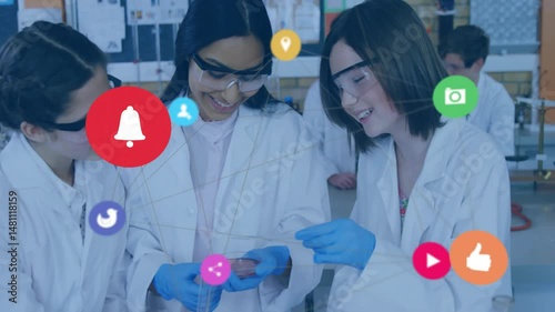 Student researchers examining petri dish in science education lab, with social media icons floating