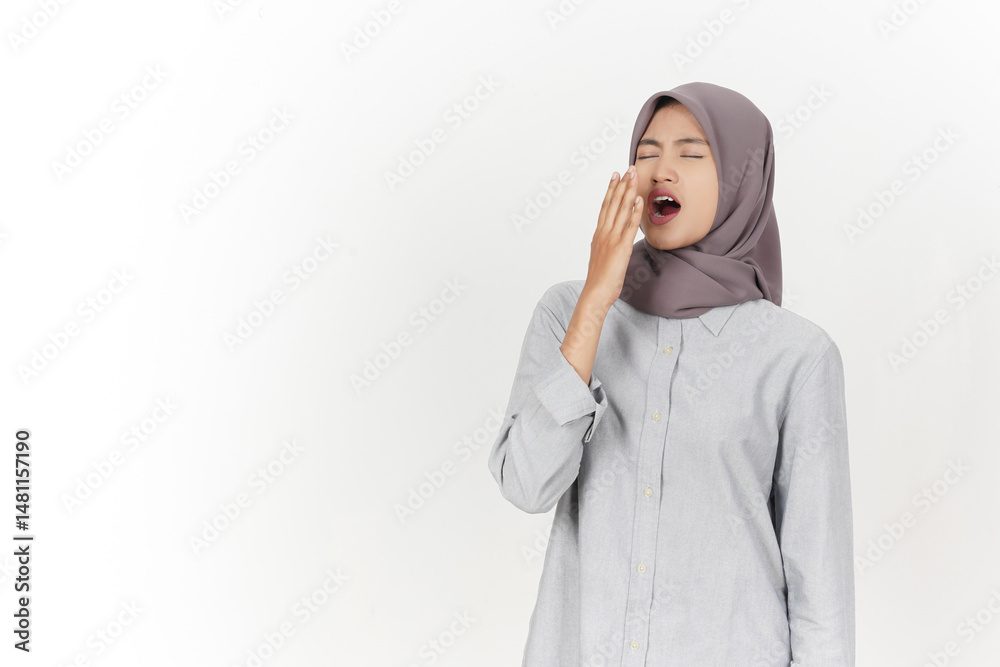Sleepy and Yawning Gesture Of Beautiful Asian Woman Wearing Hijab Isolated On White Background Sleepy and Yawning Gesture Of Beautiful Asian Woman Wearing Hijab Isolated On White Background