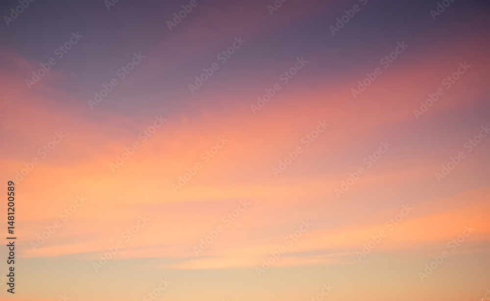 Fototapeta premium Sky with soft pastel colors ranging from orange to purple at sunset.