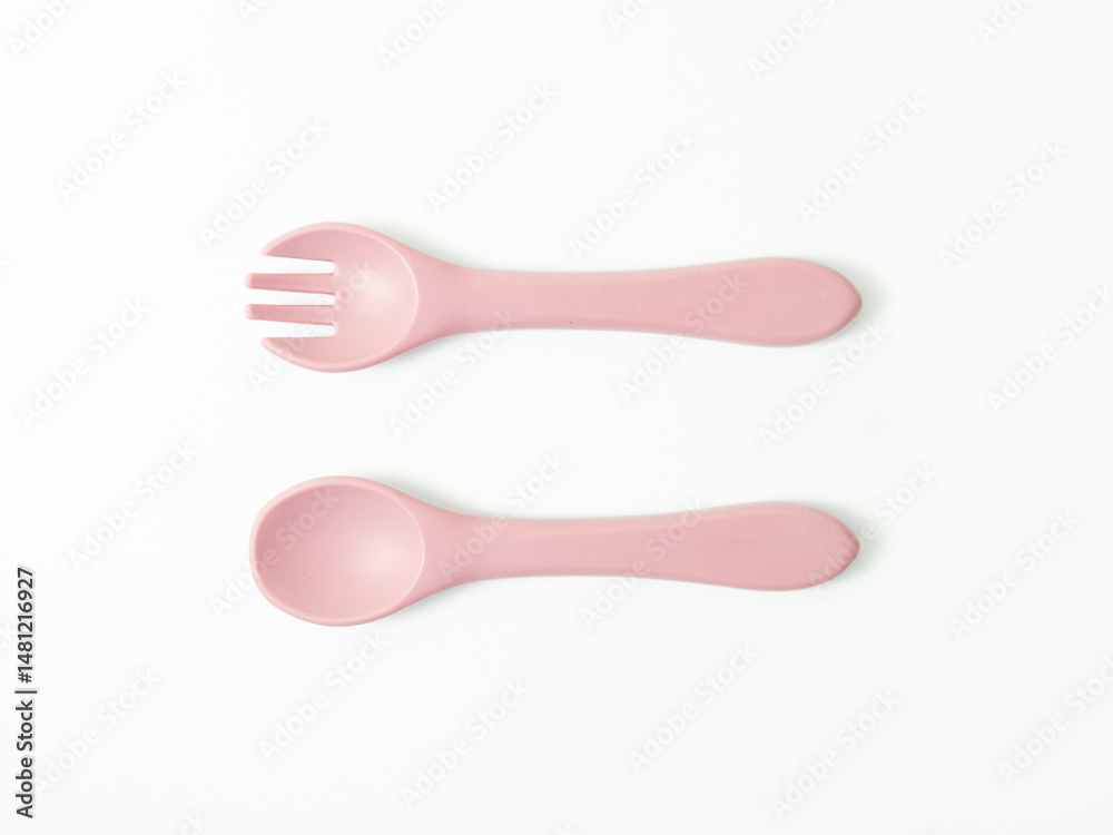 Set of pink baby utensils for feeding. Flat lay on white background, suitable for parenting blog or children’s product catalog. Set of pink baby utensils for feeding. Flat lay on white background, suitable for parenting blog or children’s product catalog.