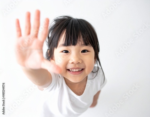 Japanese Girl Reaching Up with a Happy Smile